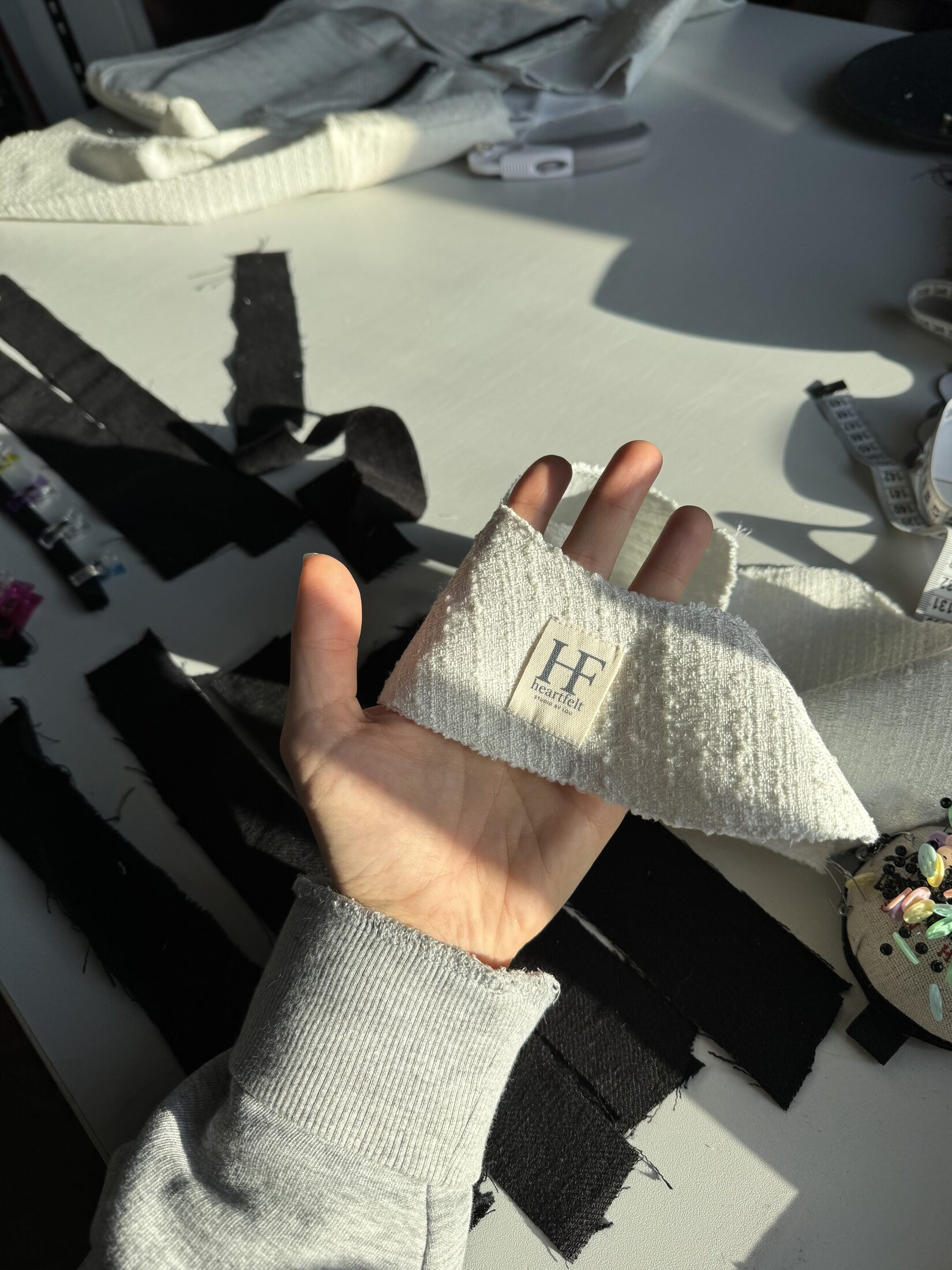 Close-up studio work in progress with fabric and seams